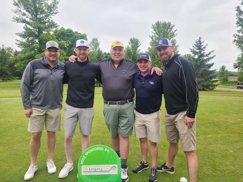Marty Oaks with four golfers from Legacy Flexo