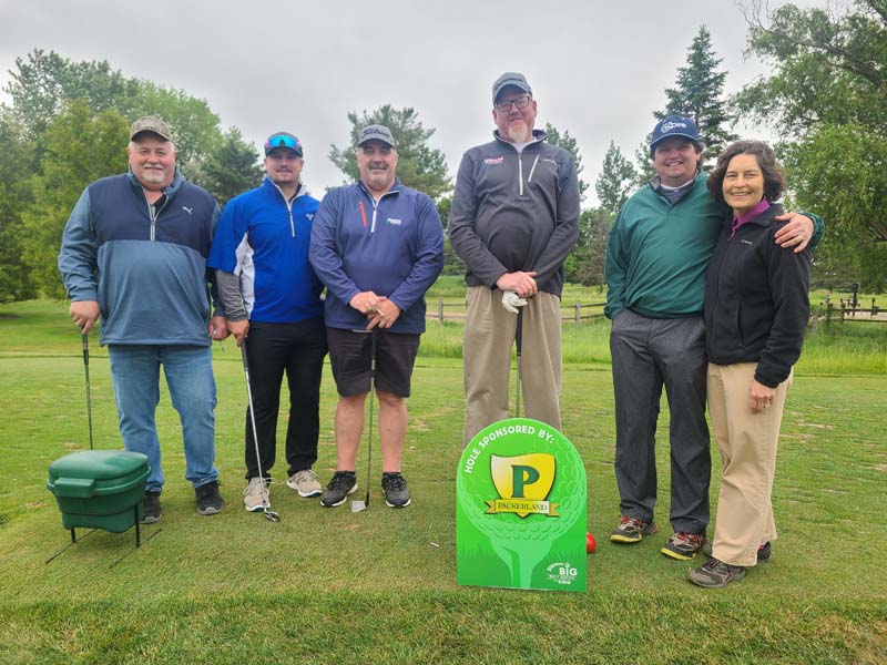 Joan and Bill Koehne from Packerland Websites with four other golfers