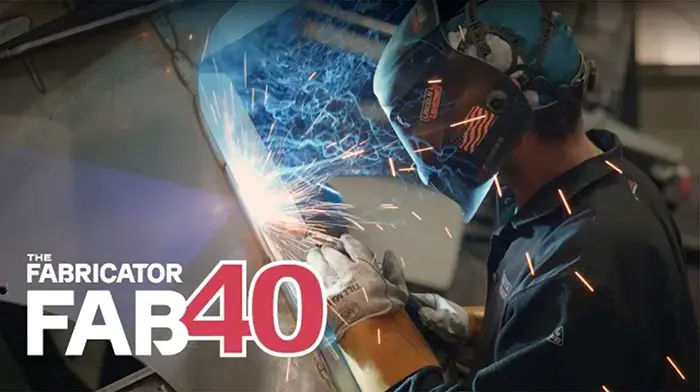 person welding with welding helmet on