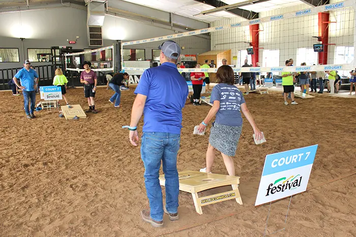 People playing cornhole