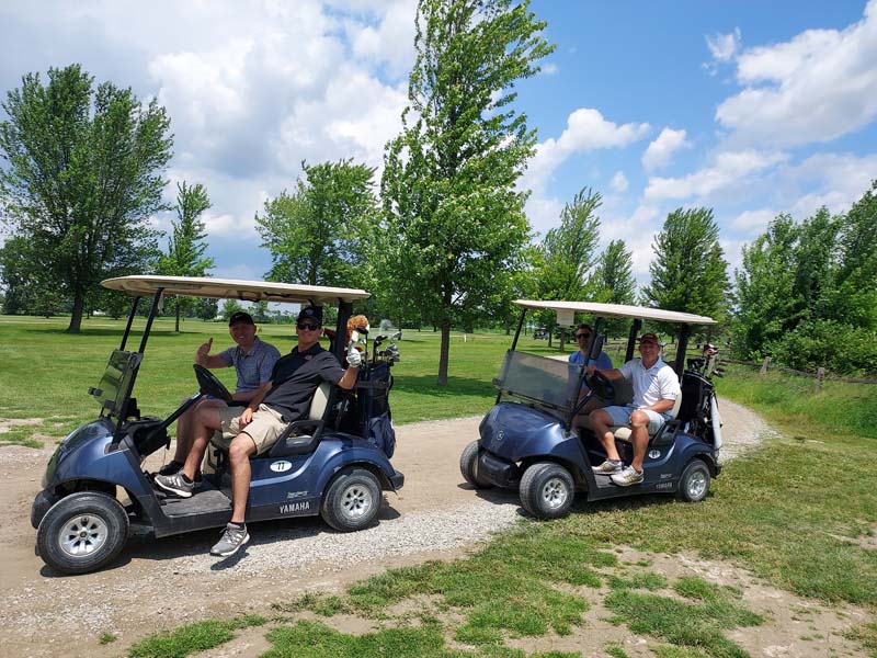 2 groups in golf carts at 2025 Swing Big event
