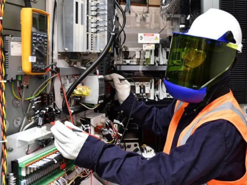 technician conducting industrial machine repair