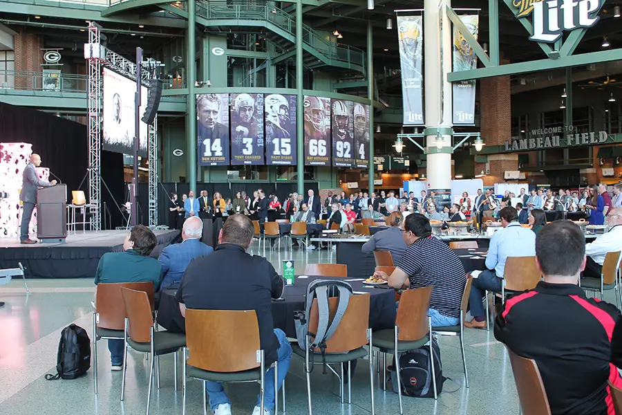 Attendees of the Manufacturing Summit sitting at tables